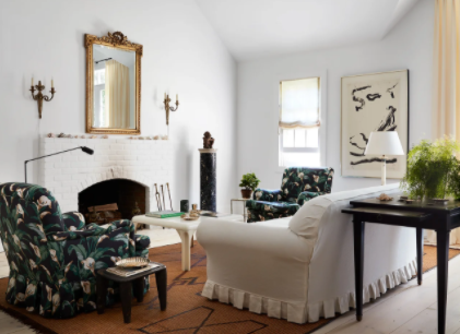 living room displaying custom mirror and prints