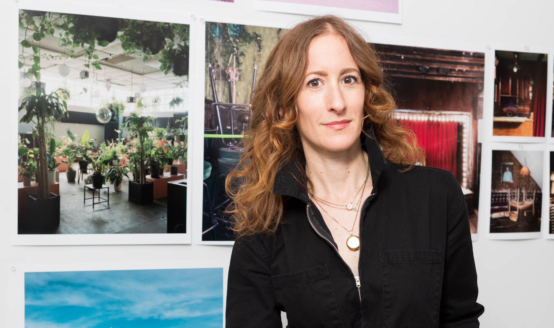 photo of Lauren Silberman standing in front of her printed work