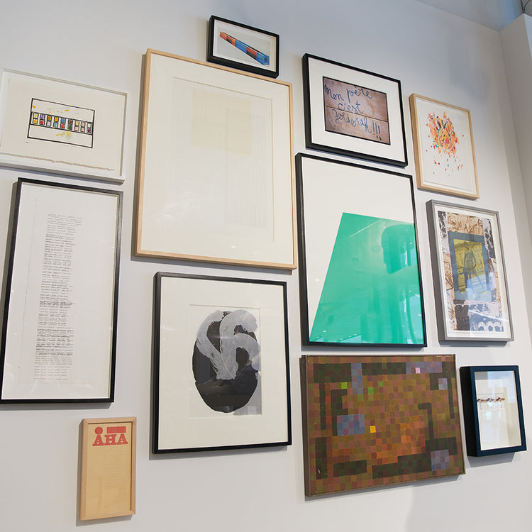 bright gallery wall with different frame styles and graphic prints