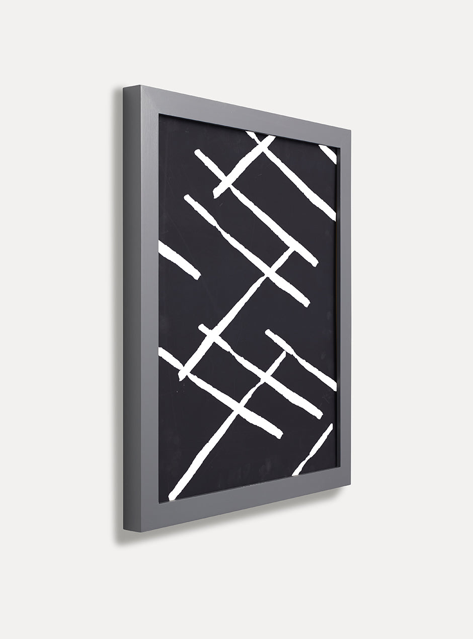 side view of grey frame holding abstract art