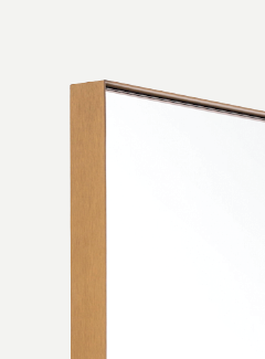 close up of brass framed mirror