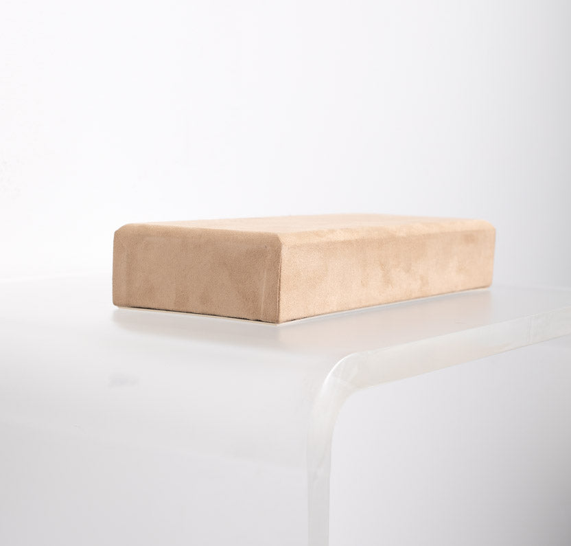 12 inch riser covered in tan suede material made for retail store displays