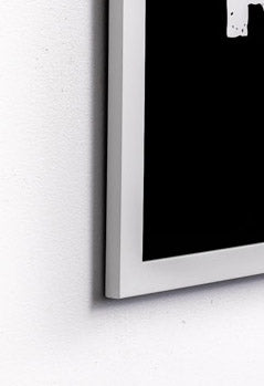 up close detail photo showcasing dark print in a white frame