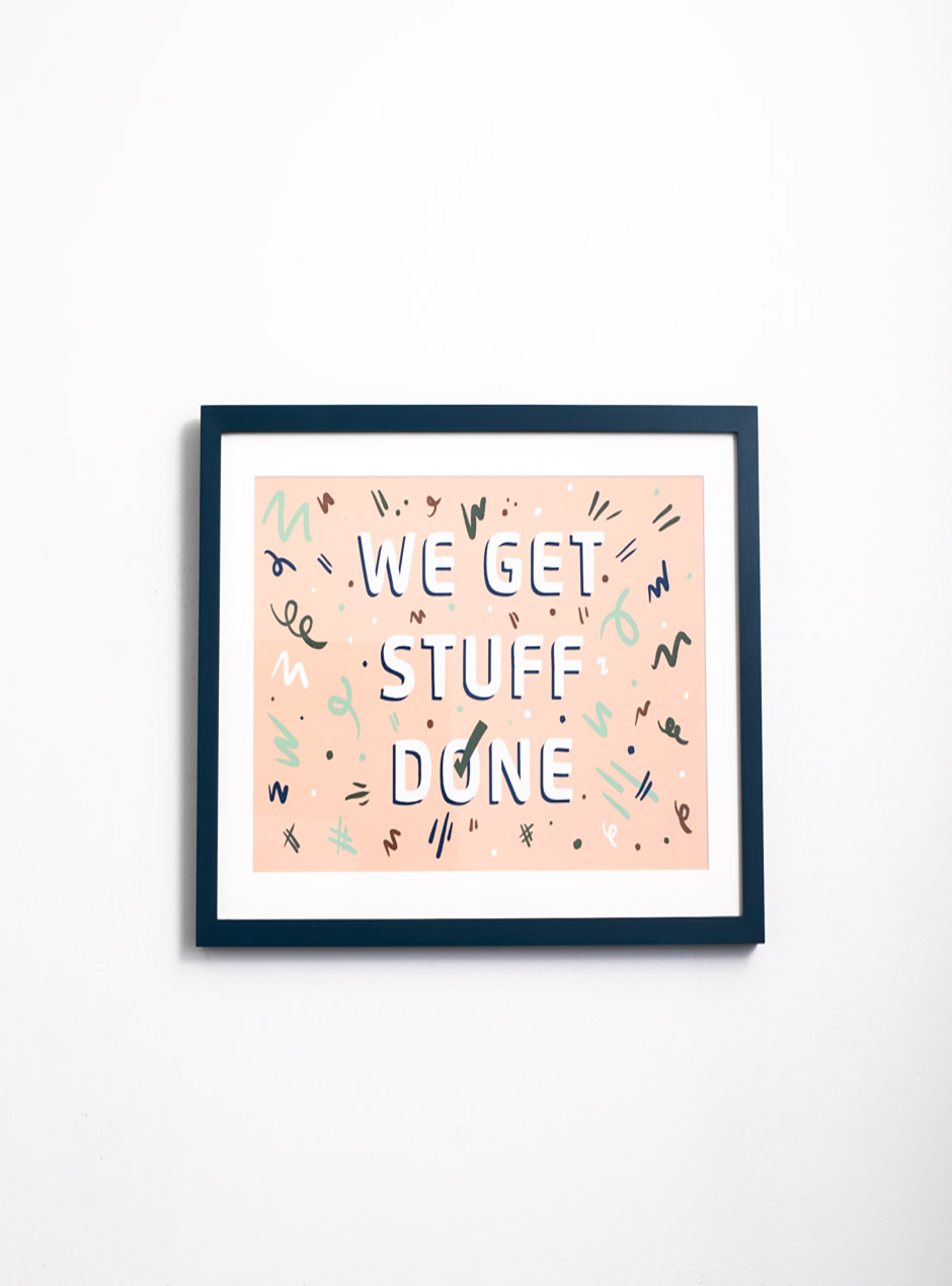 We get stuff done on pink background in navy frame 