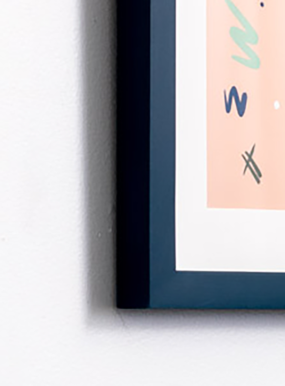 close up We get stuff done on pink background in navy frame 