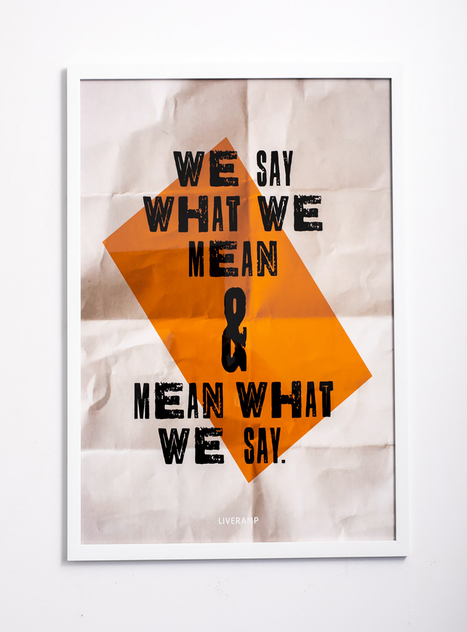 white and orange we say what we mean and mean what we say in thin white frame
