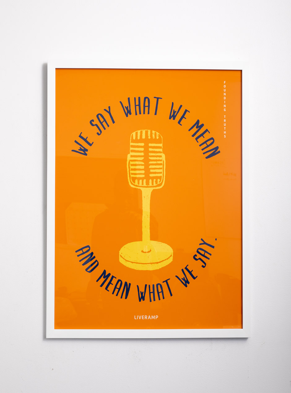 yellow, navy and orange we say what we mean and mean what we say in thin white frame