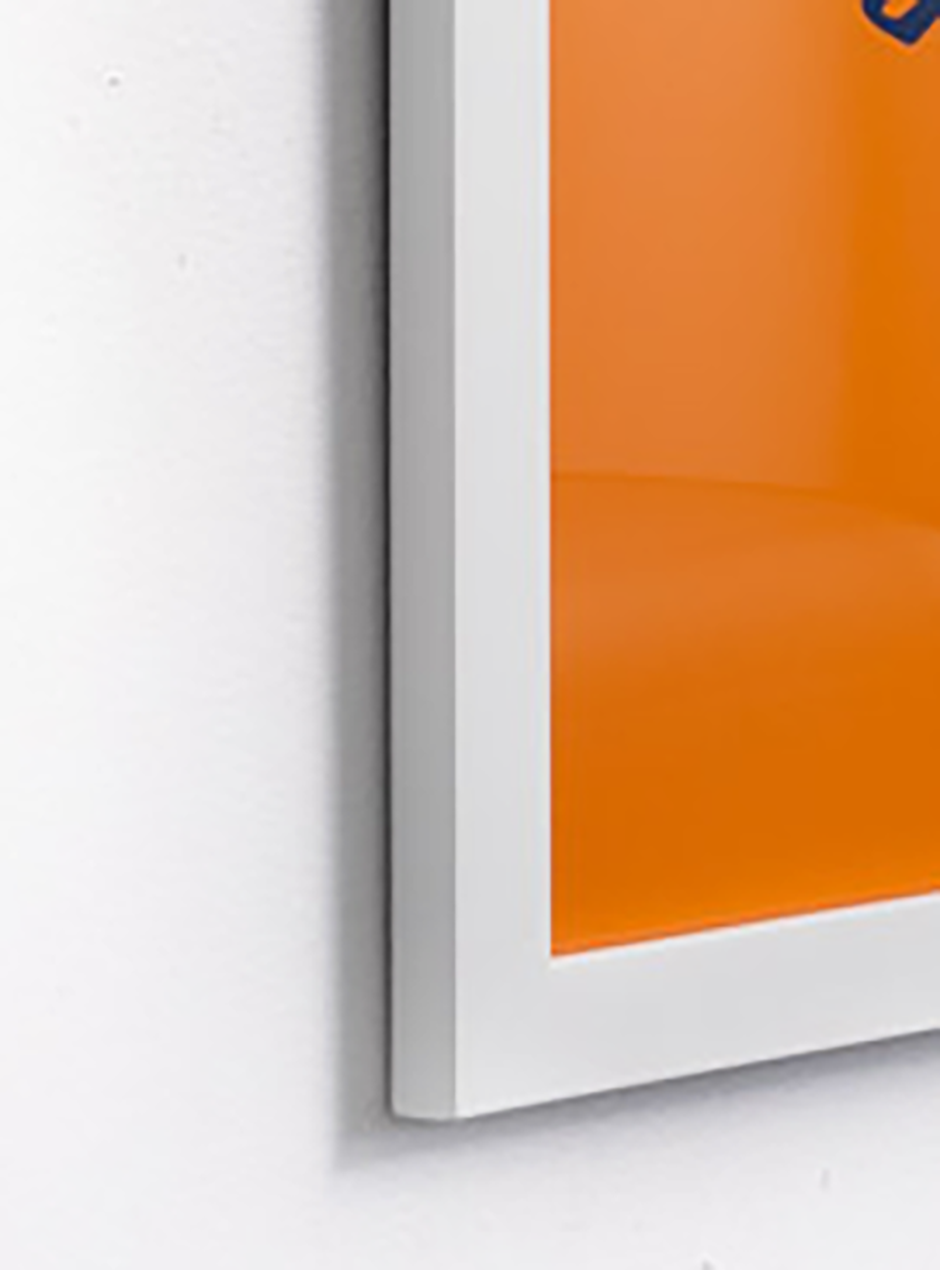 close up yellow, navy and orange we say what we mean and mean what we say in thin white frame