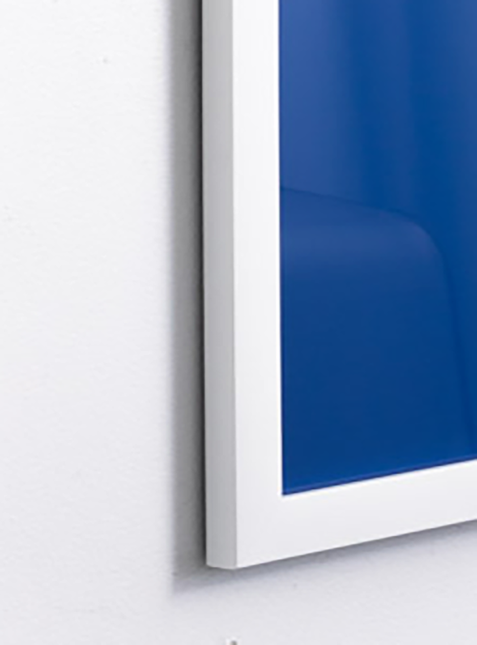 close up we empower people on blue background with yellow arrow in thin white frame