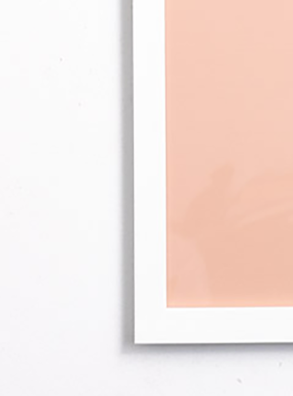 close up We Love Our Customers on pink background with navy stereo in thin white frame 