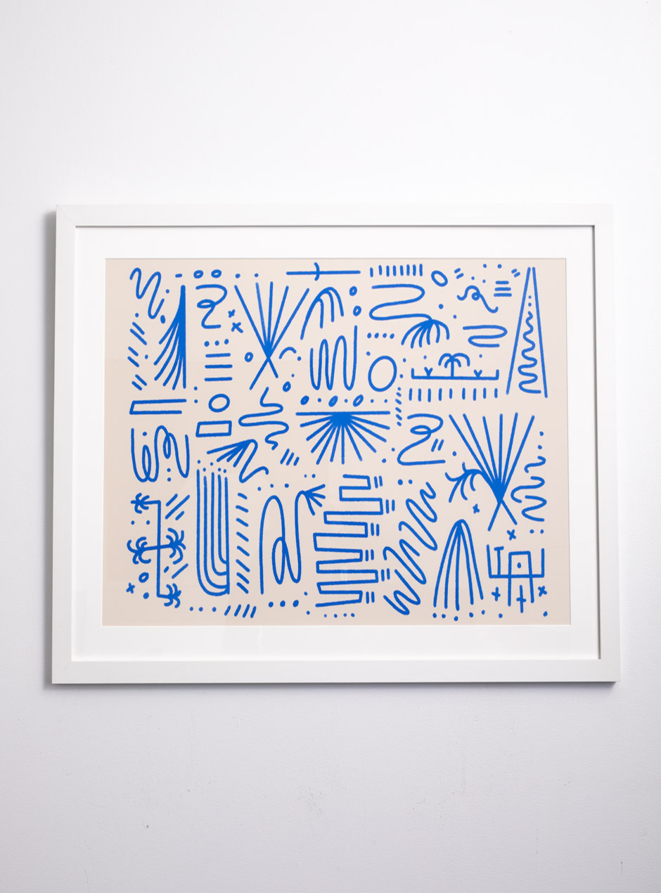 beige and peach backdrop with blue squiggly lines and pieces that resemble suns with white mat in a high quality white colored frame