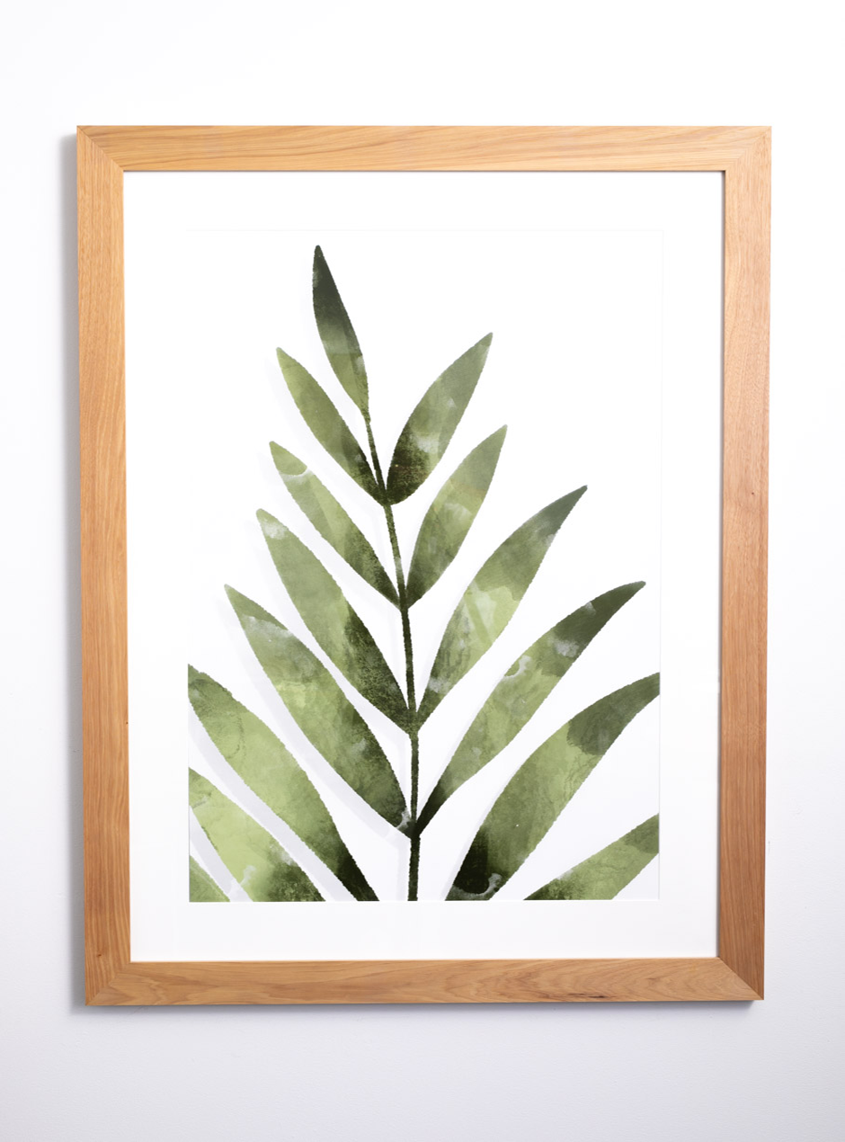 palm leaf in oak frame