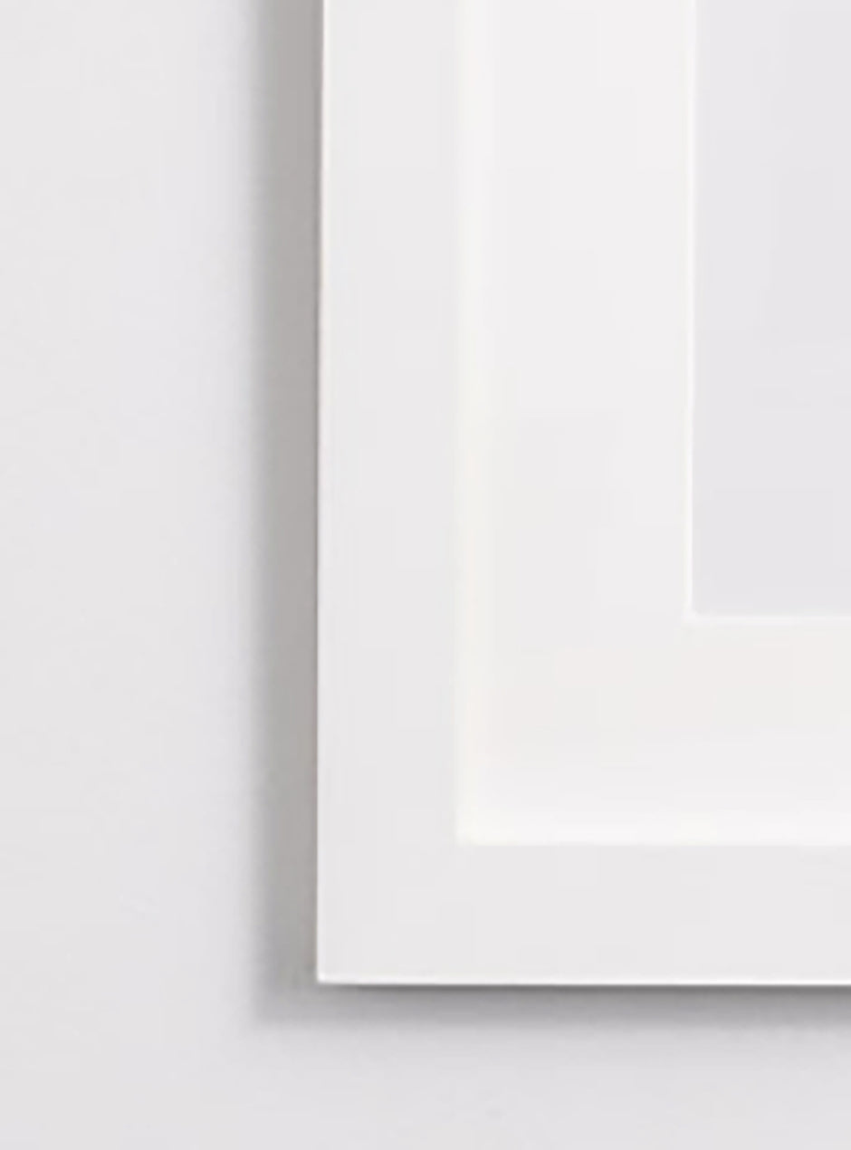 close up yellow taxi print in white frame