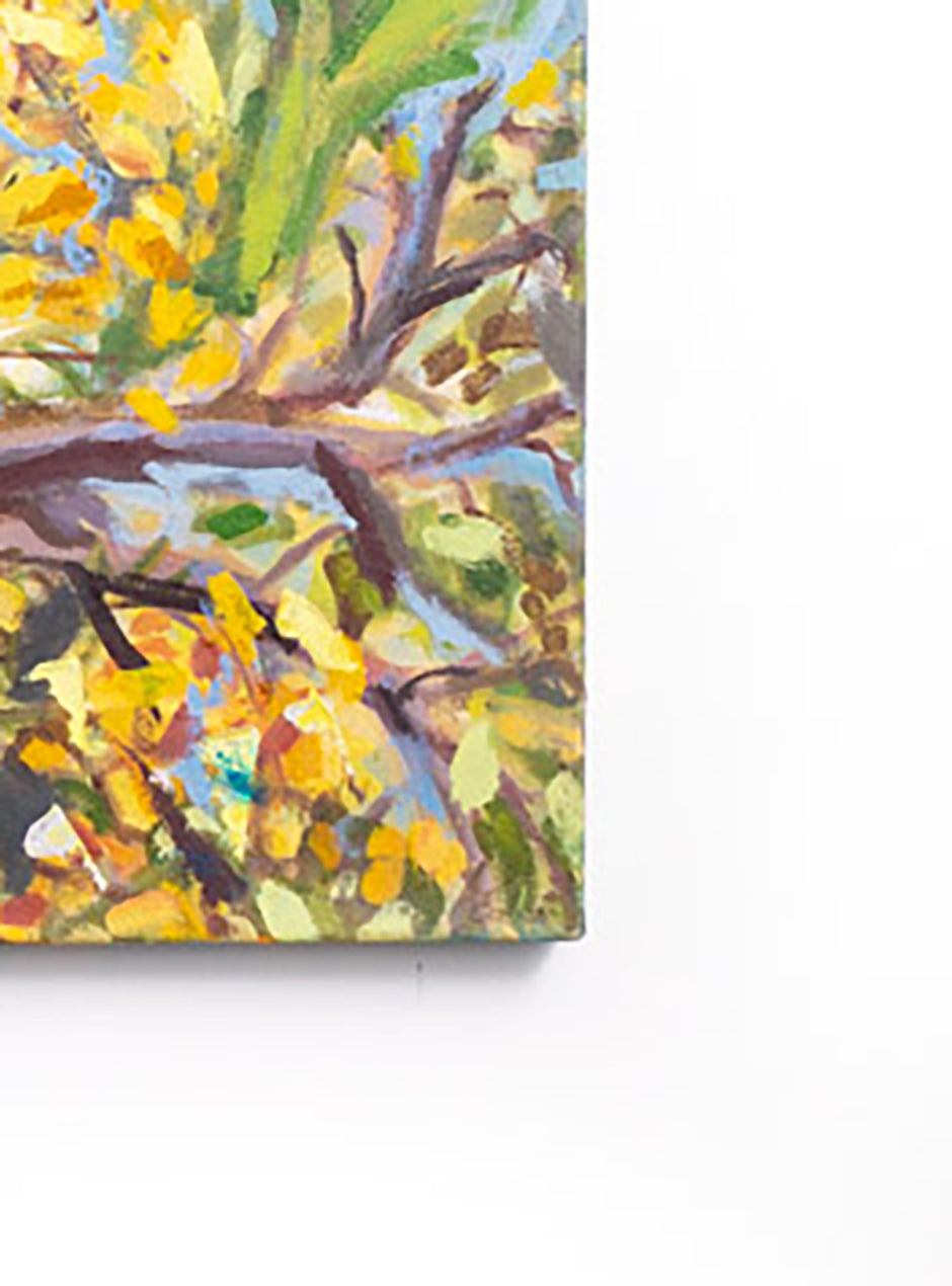 close up of corner of handpainted sunflowers on canvas