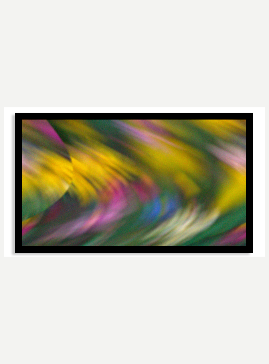 abstract artwork using yellow green pink and blue in black frame