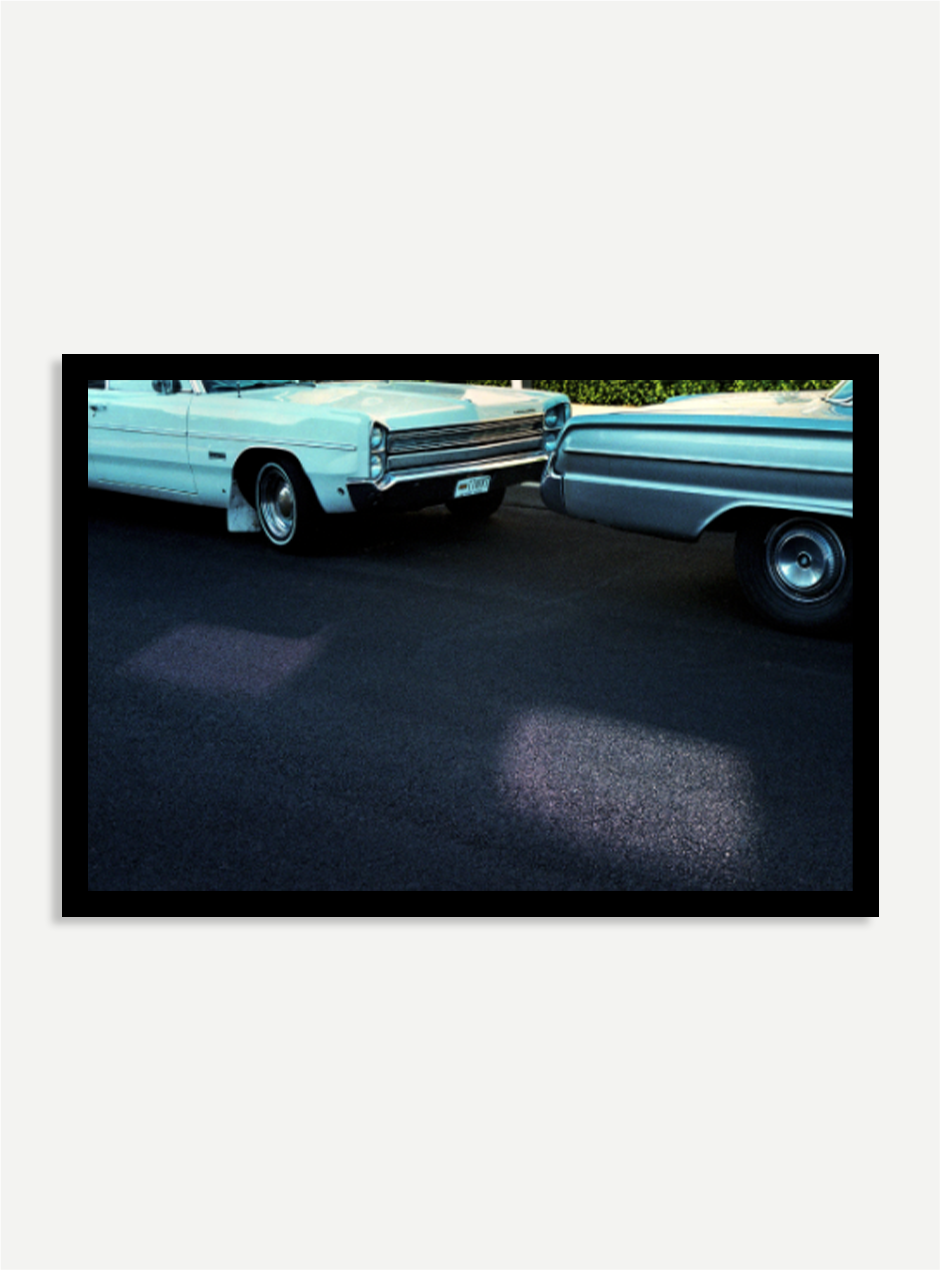 old cars on road photograph In black frame