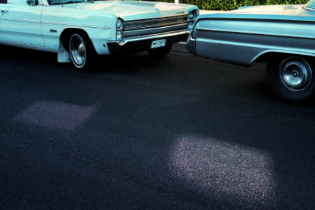 old cars on road photograph