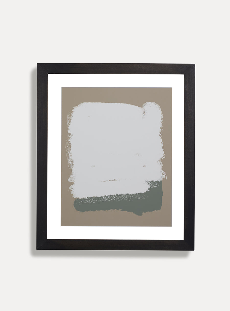 abstract tan, white and green print in black frame on white wall