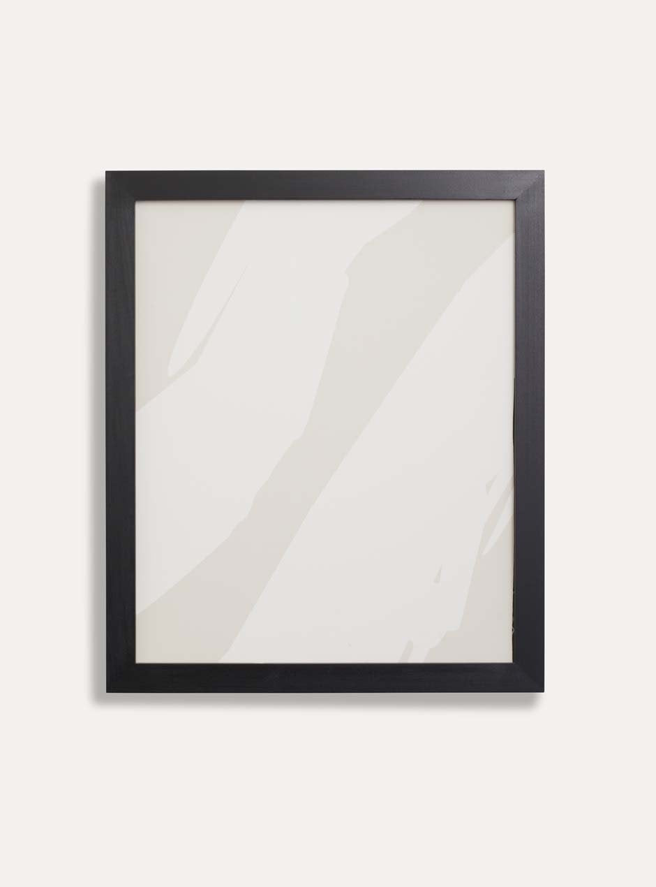 black solid poplar frame with neutral blotchy modern artwork against white wall