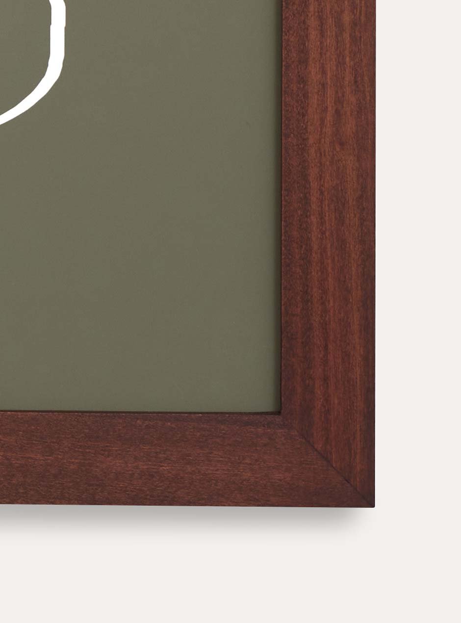 corner view dark stained wooden frame holding abstract painting