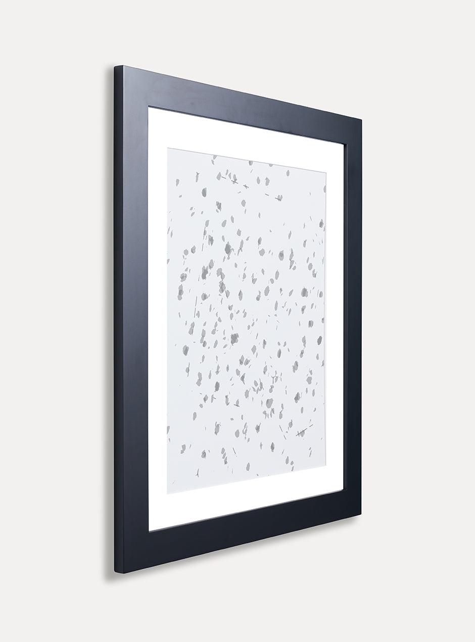 Side view of black frame holding abstract art