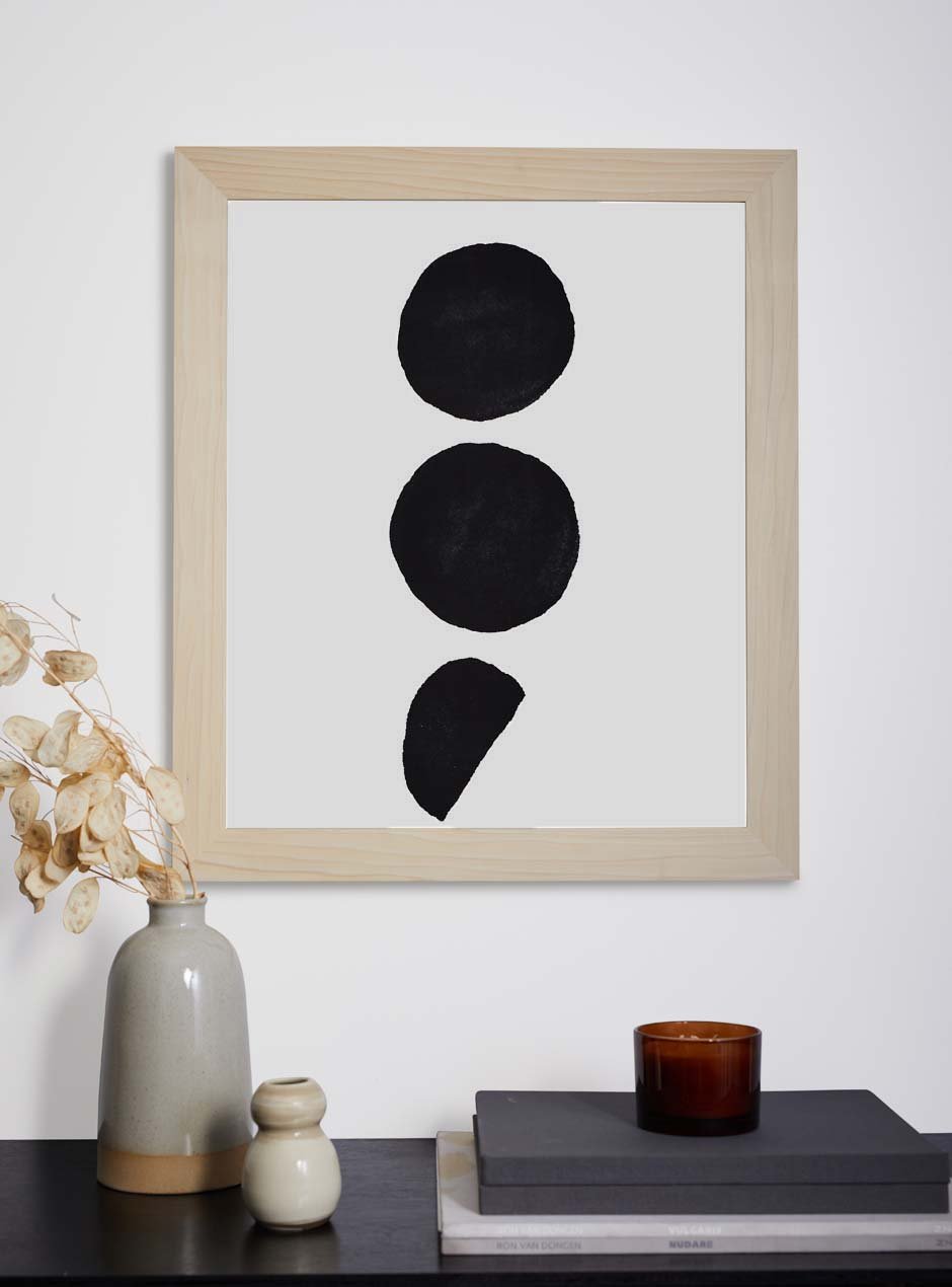 light wooden frame hung in home