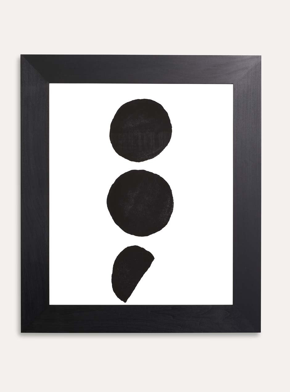 3 black dots on white background print framed in black frame