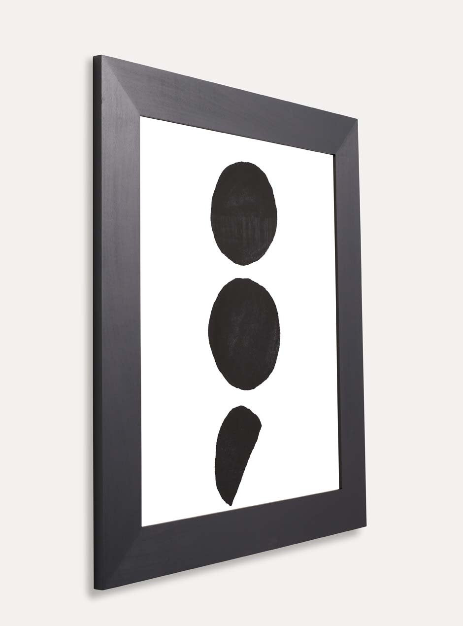 3 black dots on white background print framed in black frame