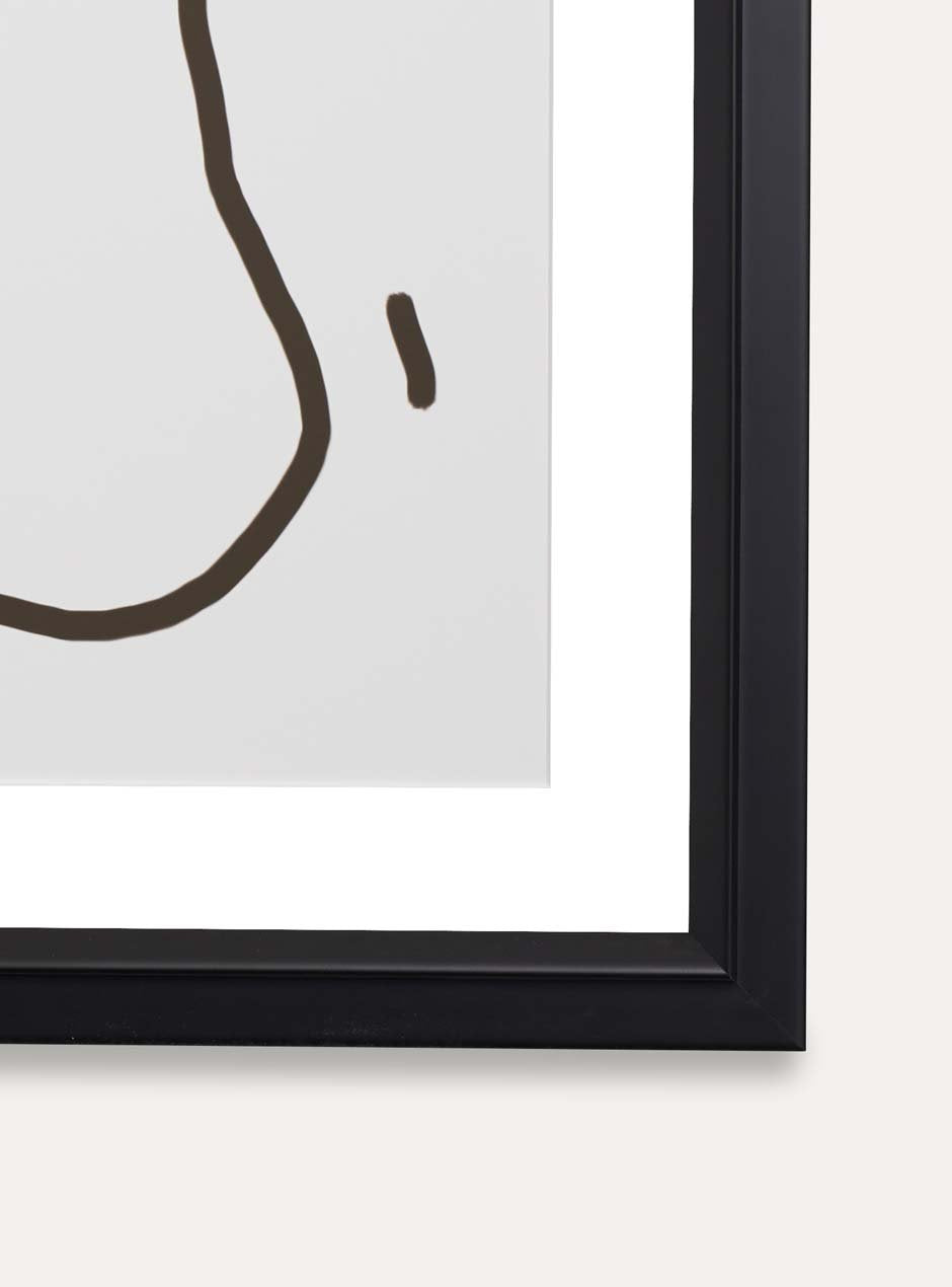 close up corner view of black matte frame holding abstract art