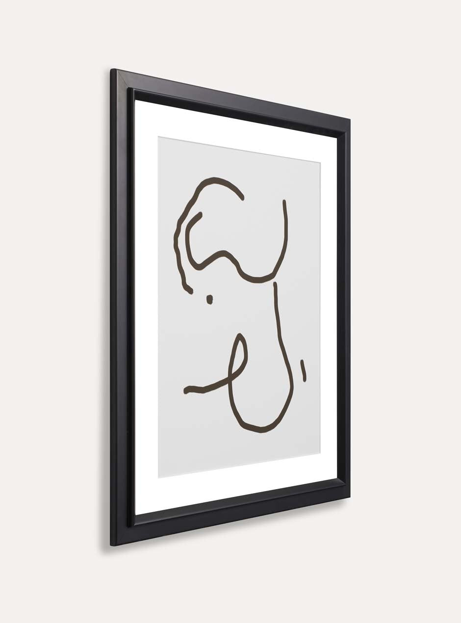 side view black matte frame holding abstract art