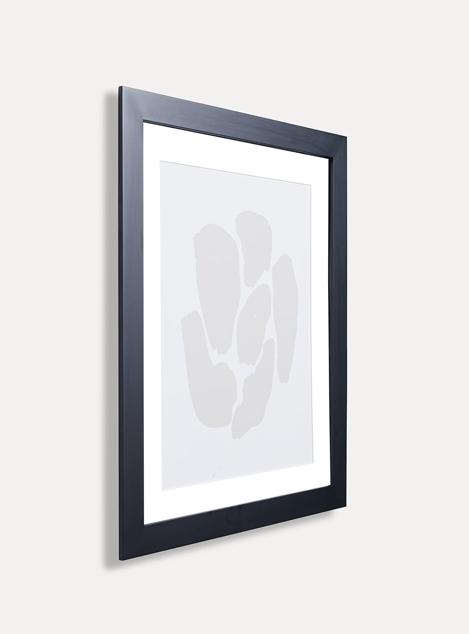 side view of black frame with abstract art
