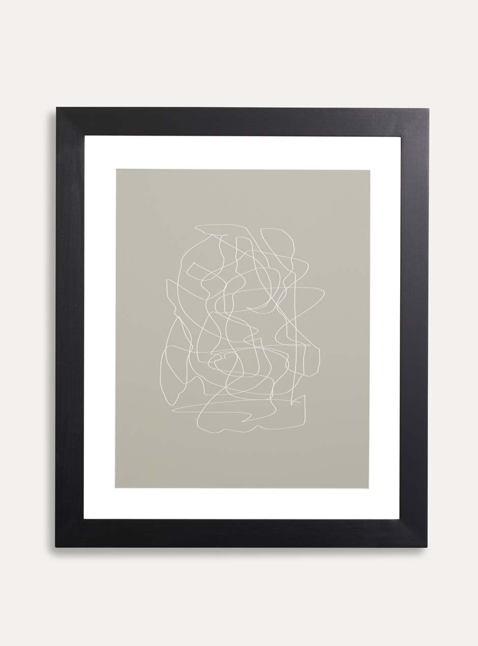 black solid poplar frame with neutral blotchy modern artwork against white wall
