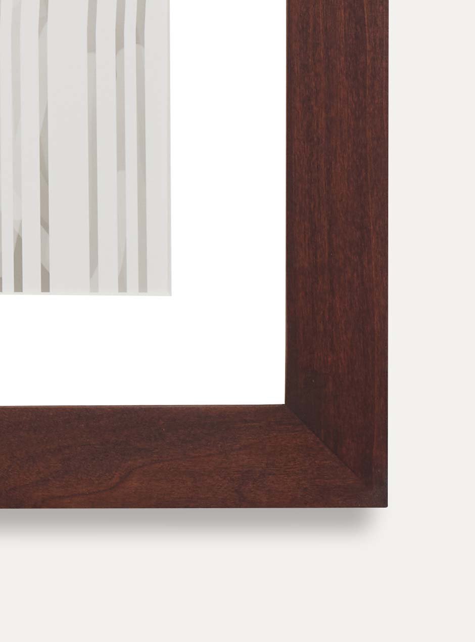 corner view dark stained wooden frame holding abstract painting 
