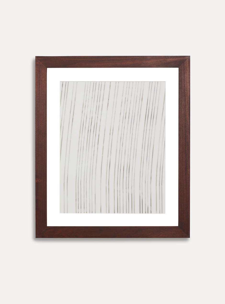 dark stained wooden frame holding abstract painting 