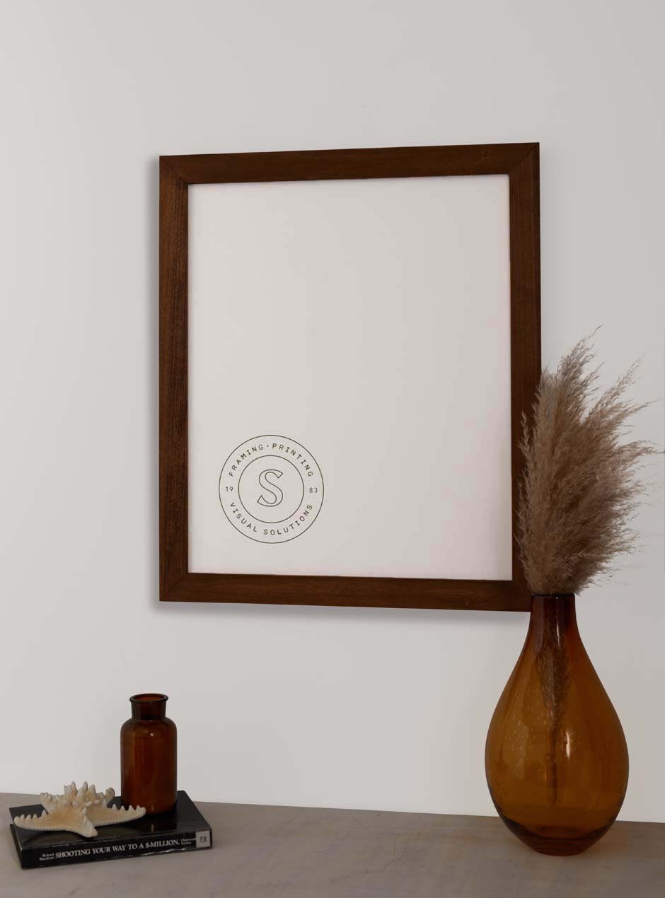 wooden frame hung above table with various objects 