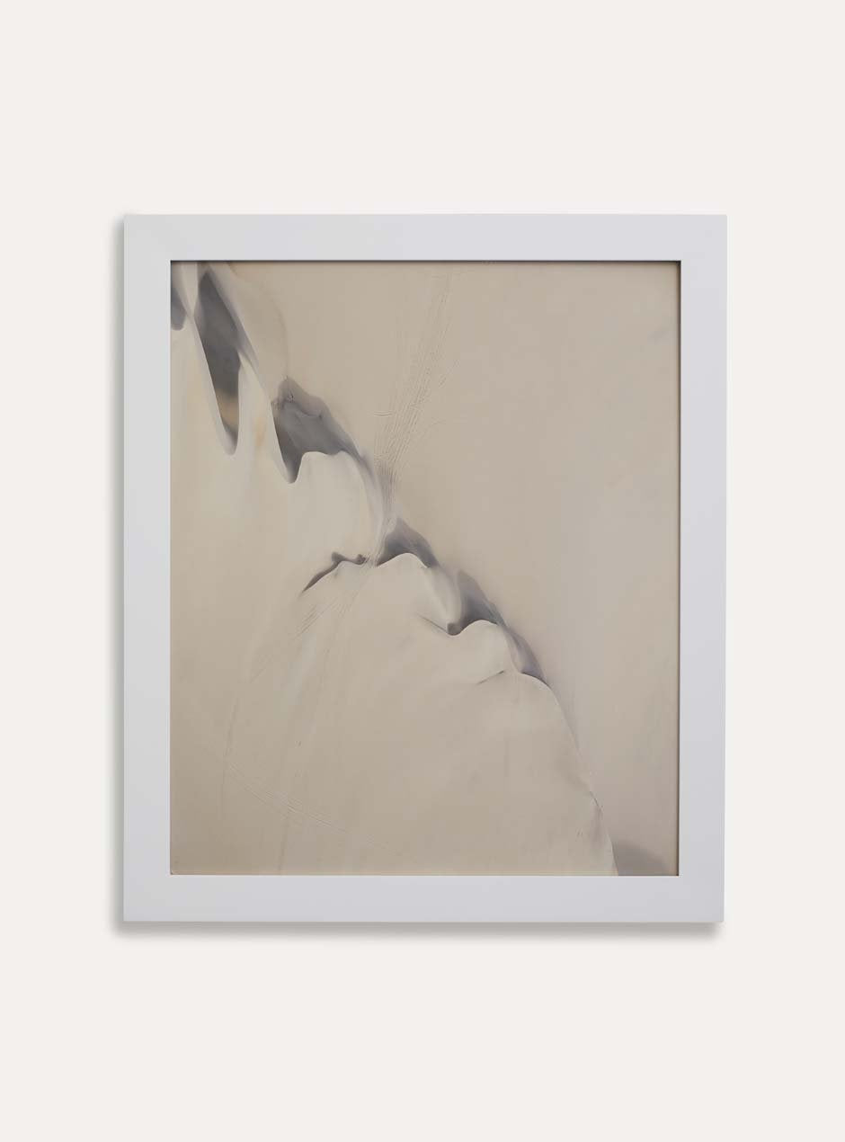 white frame holding abstract art