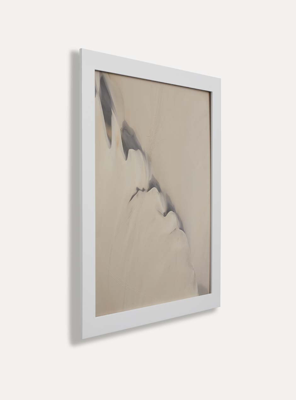 Side view of white frame holding abstract art