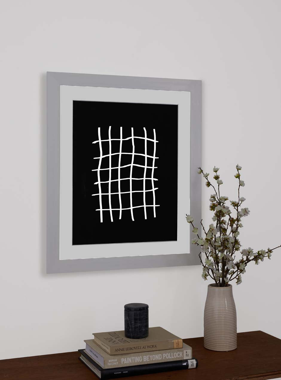 white frame hung in home