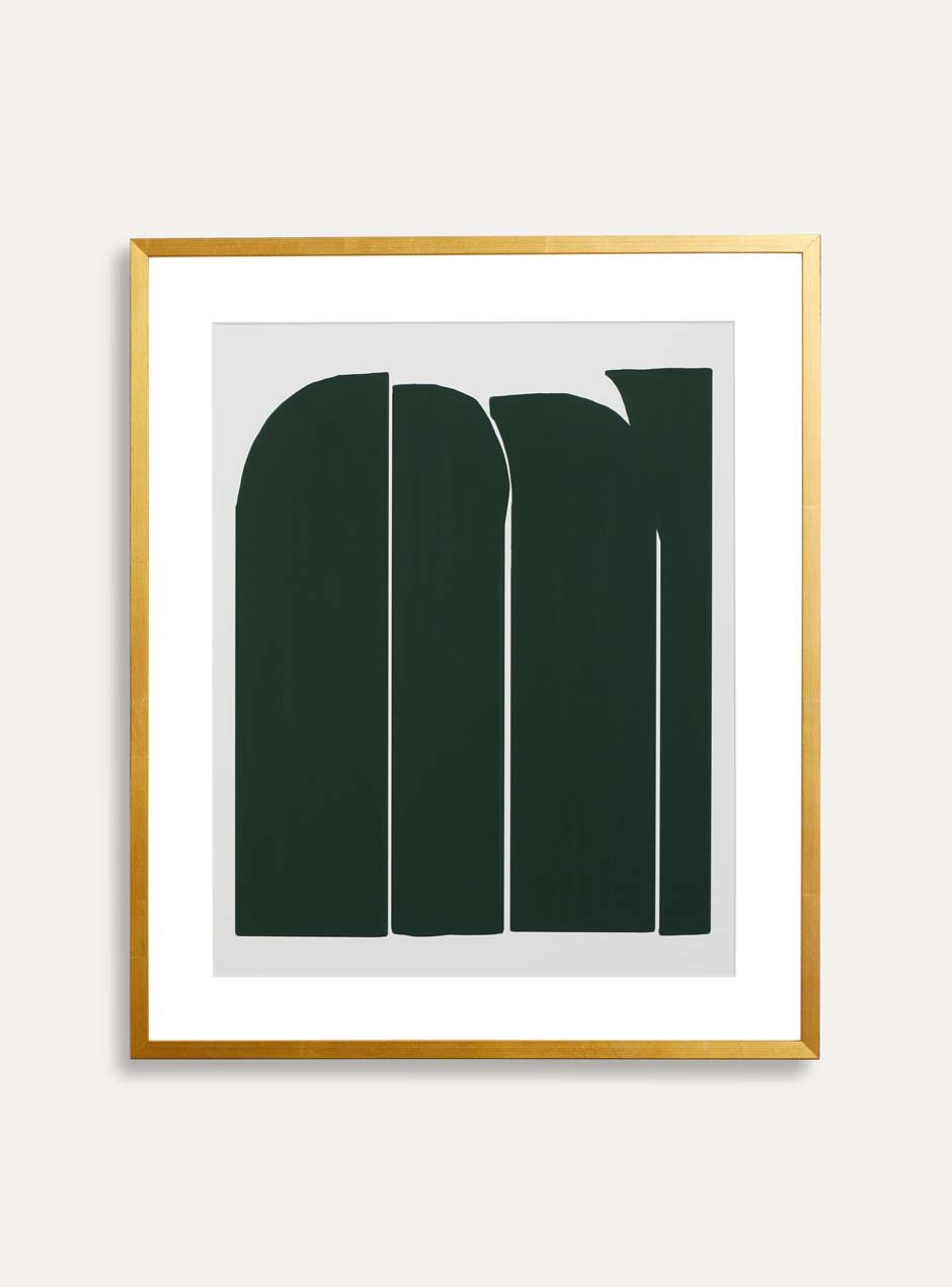 shiny yellow gold leafed high end frame with white mat border and green artwork resembling stones.