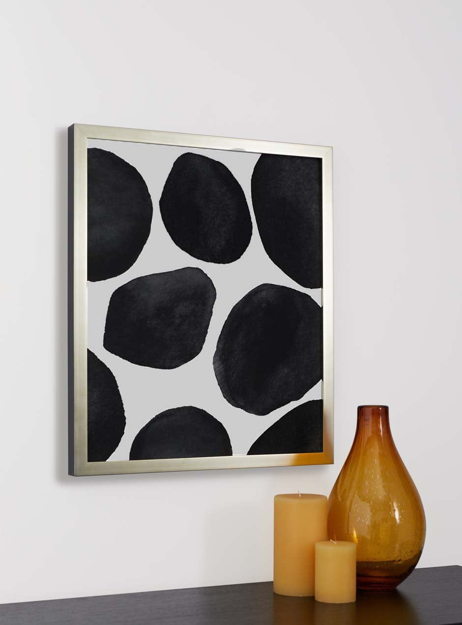 thin silver frame hung in home