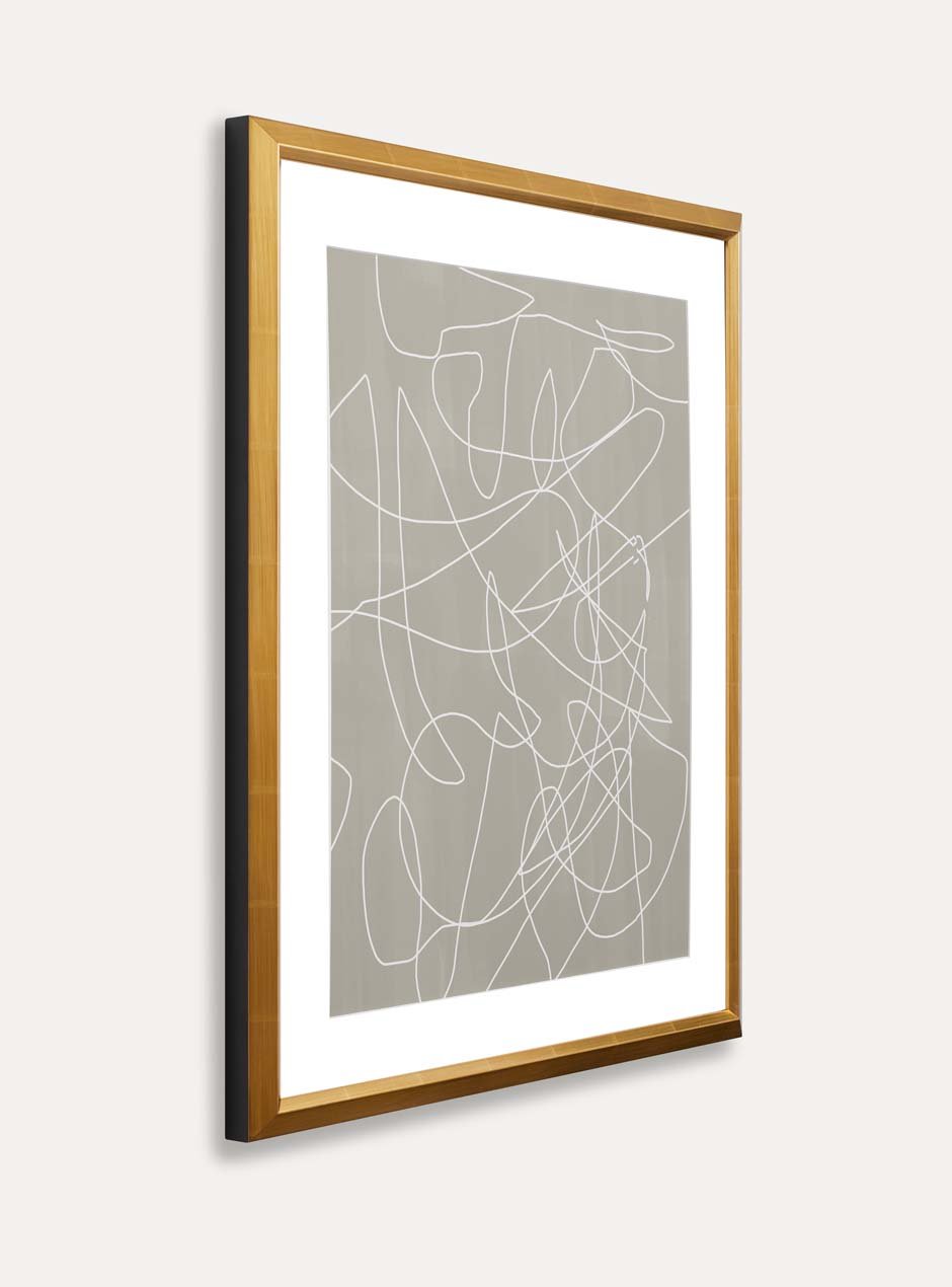 side view of gold frame with abstract art 