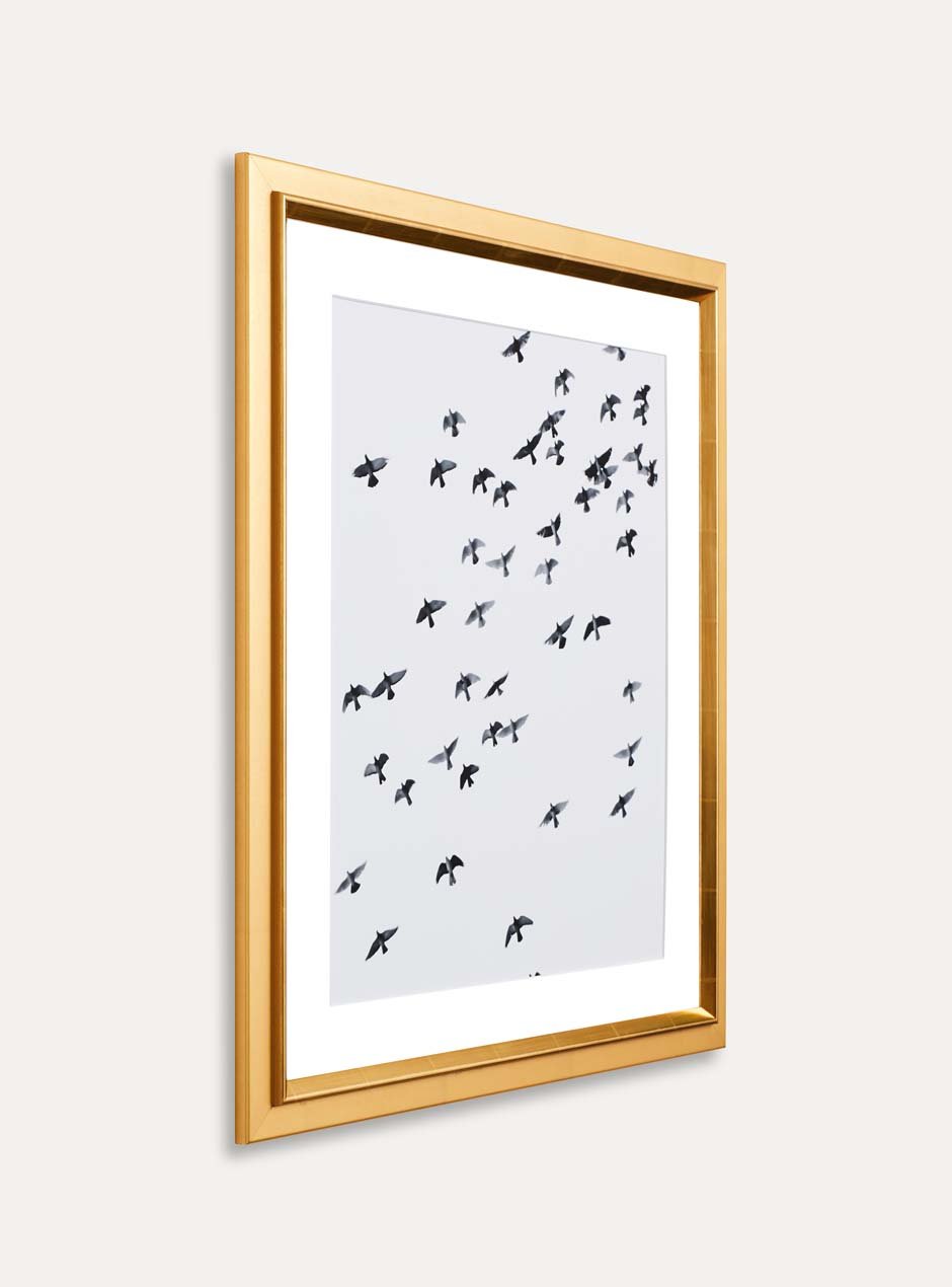 side view gold frame holding abstract art