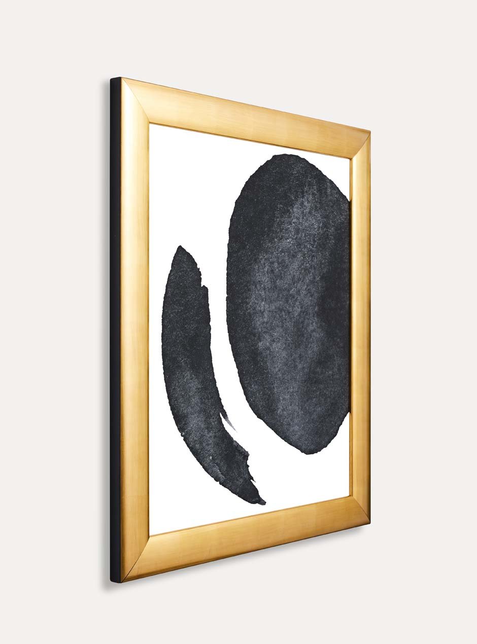 side view of gold frame holding abstract art
