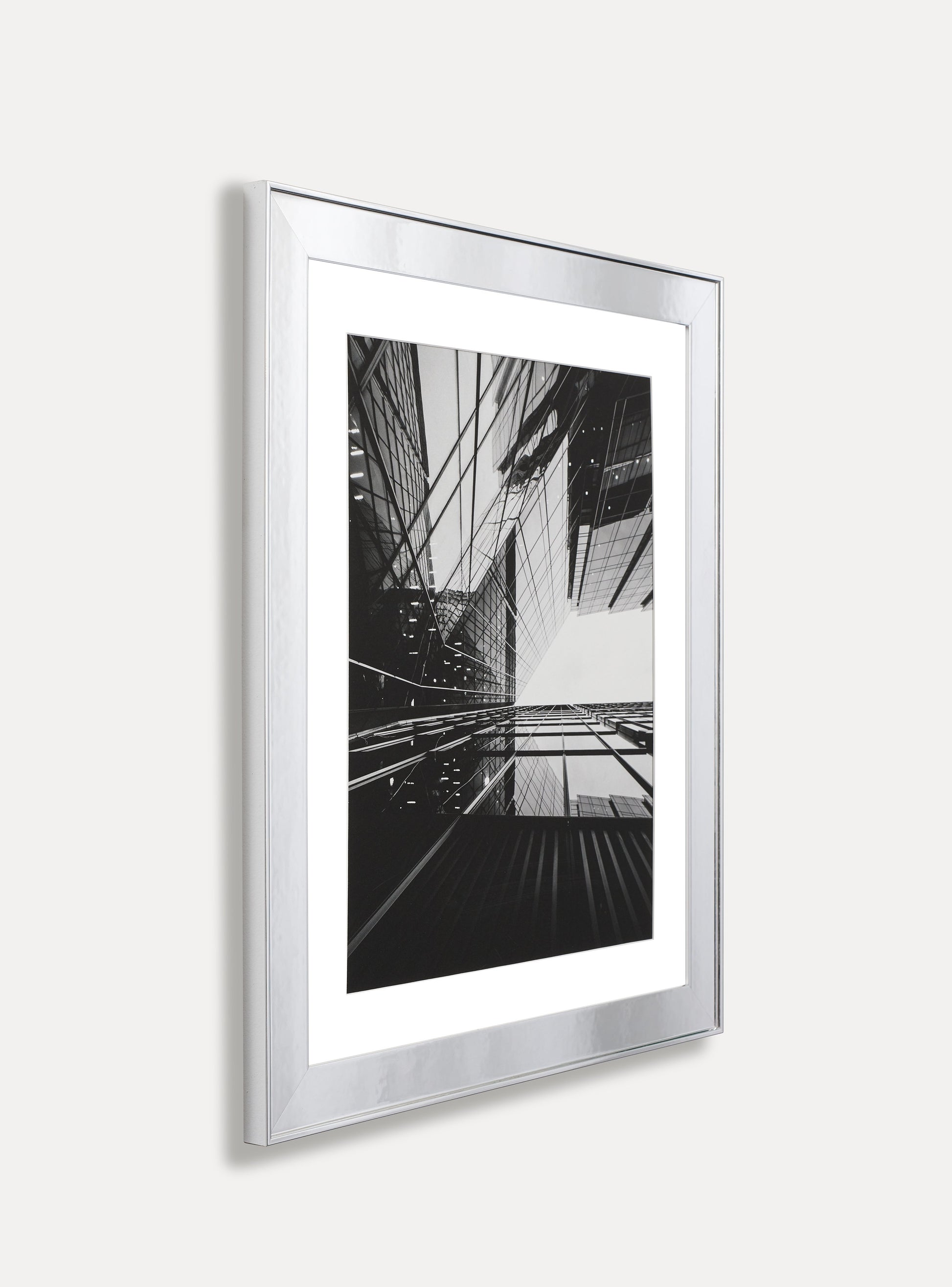 Side photo of a picture frame on an off-white wall