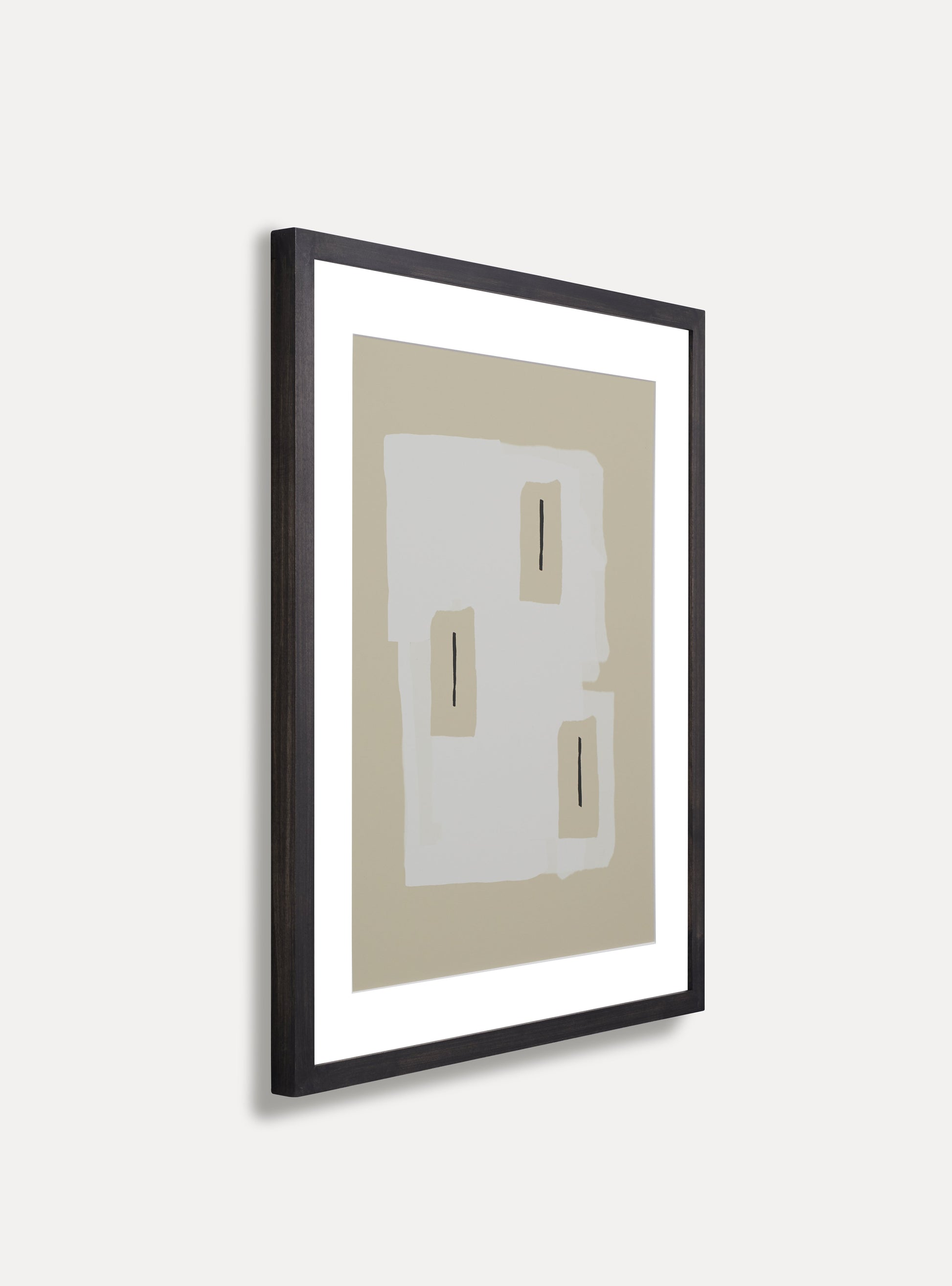 Side photo of a wooden picture frame on an off-white wall