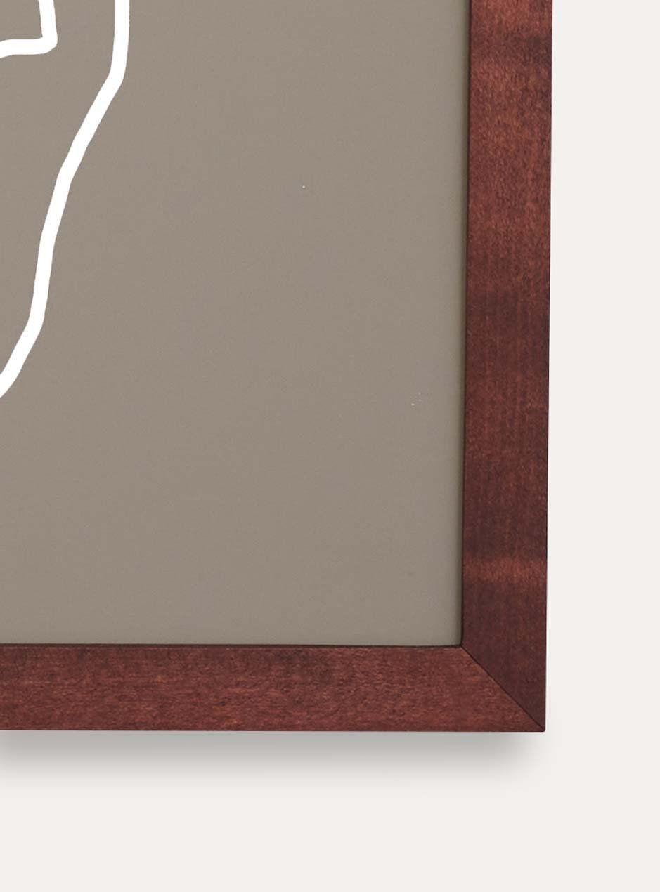 close up of corner of dark stained thin wooden frame holding abstract painting 