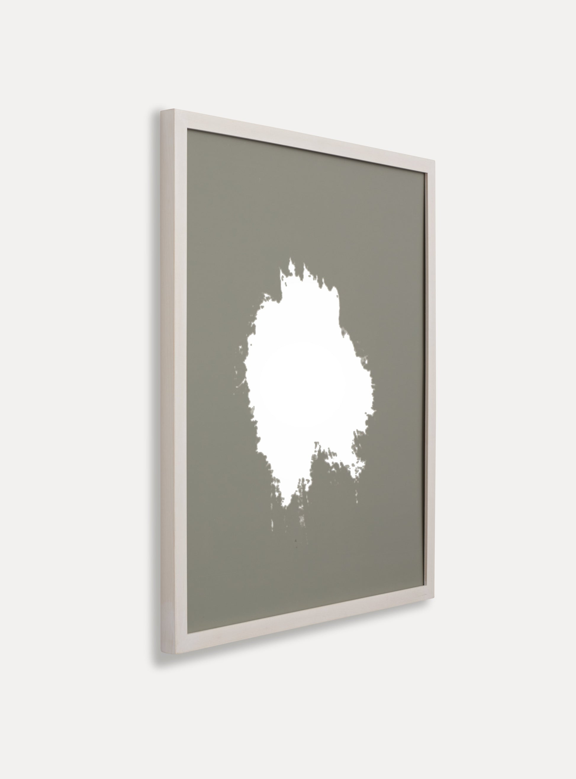 Side photo of a wooden picture frame on an off-white wall