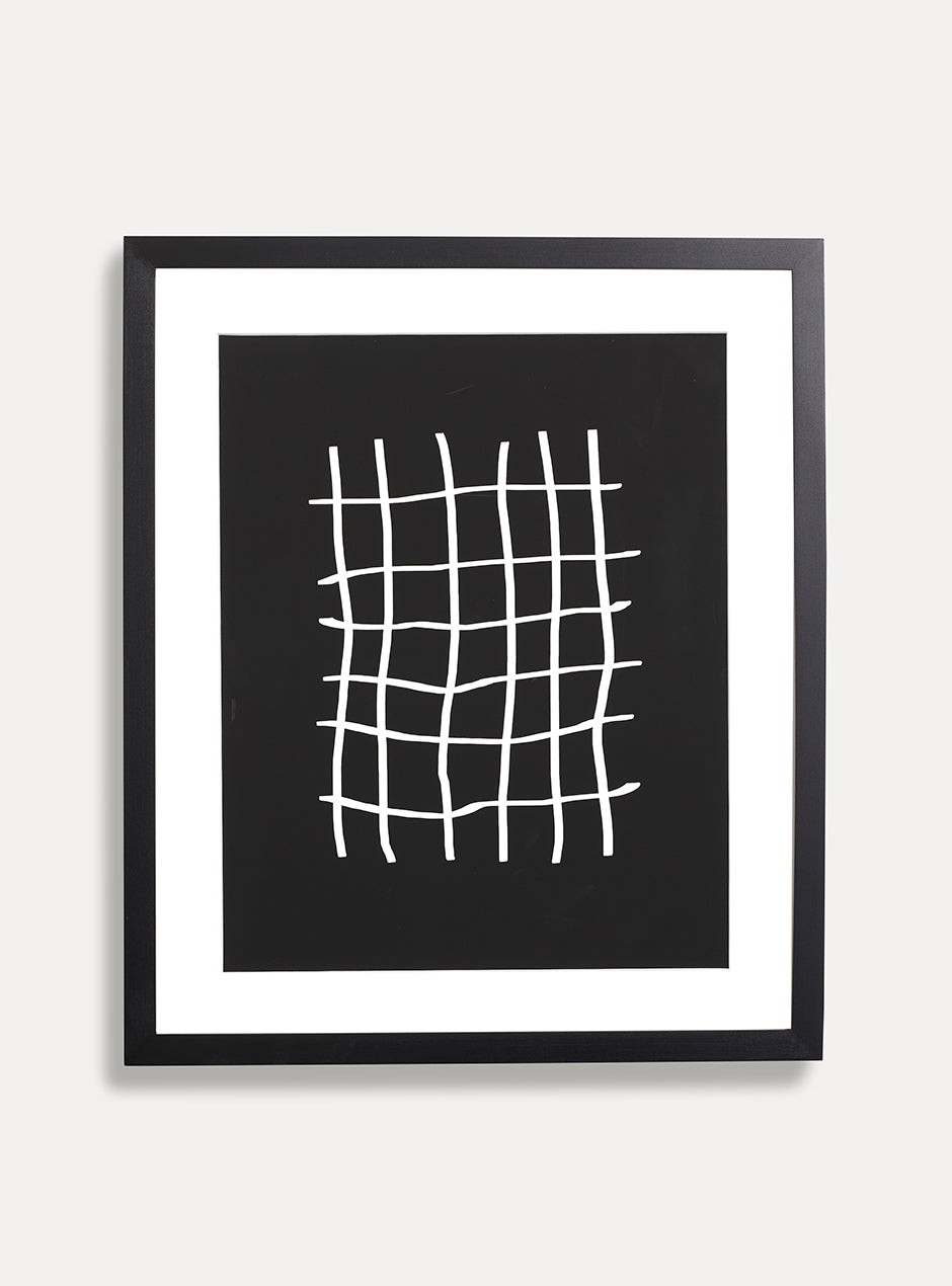 black solid maple frame with white matboard and black and white abstract art resembling a pound sign multiple times