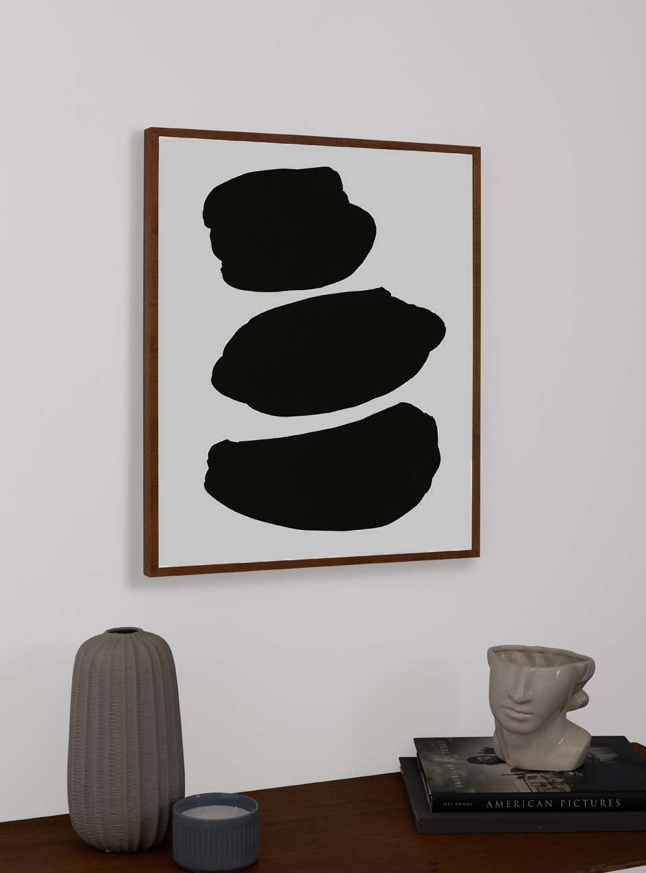thin wooden frame hung above table with various objects