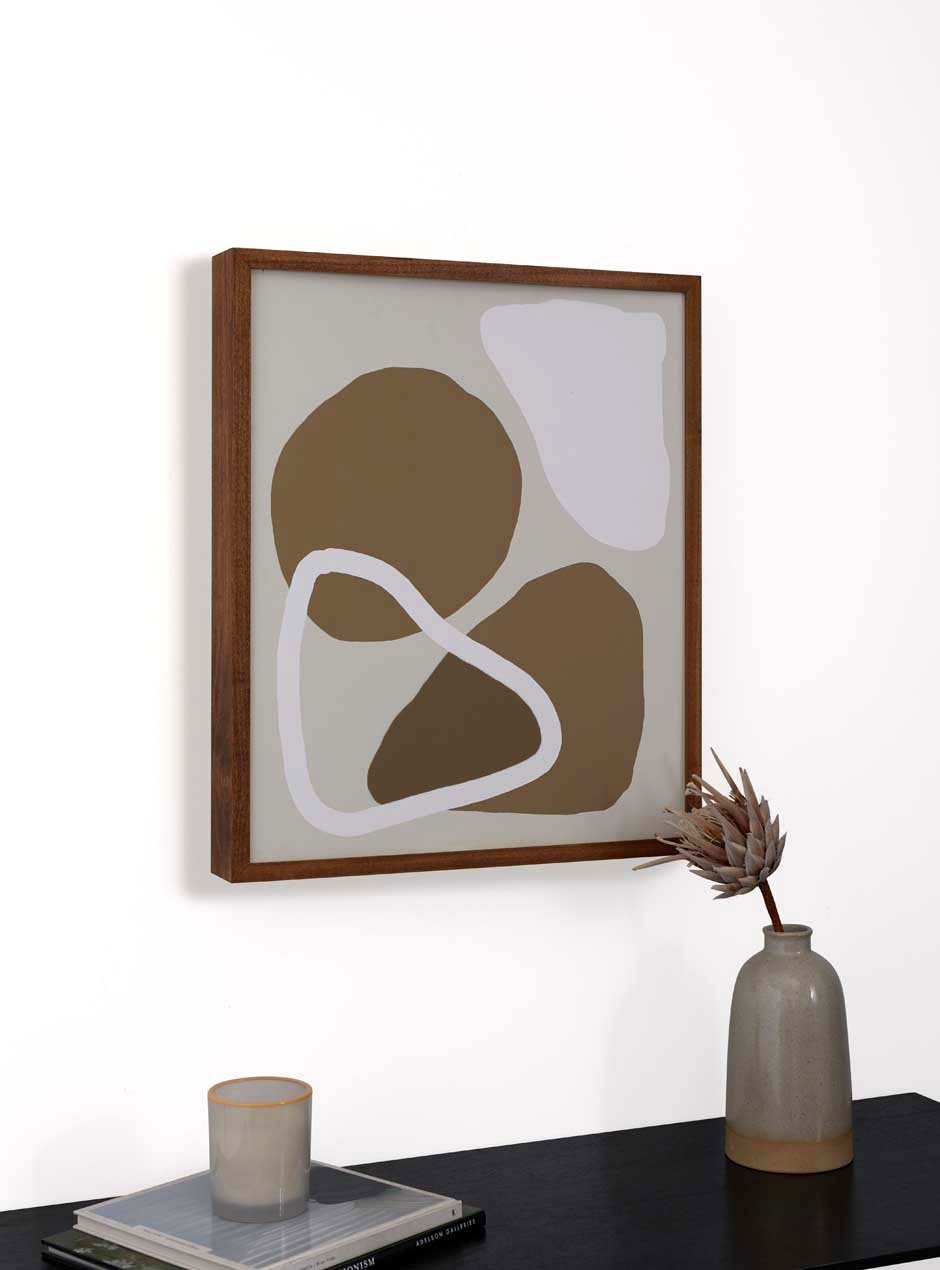 slim wood frame hung up in home